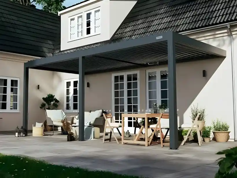 Black louvered cover over a furnished patio